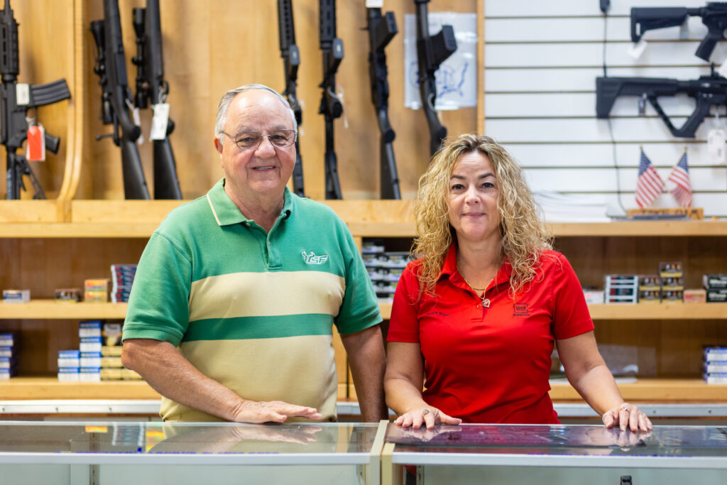Visitor checking membership registration requirements at an indoor shooting range