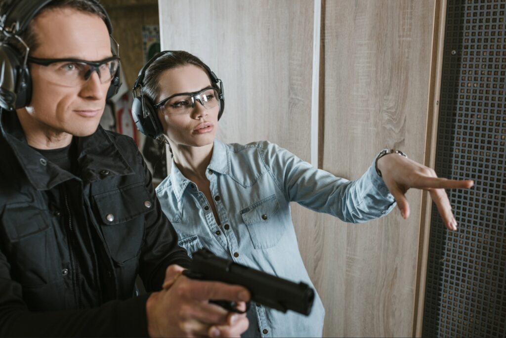 First-time shooter receiving instruction at an indoor gun range in Sarasota