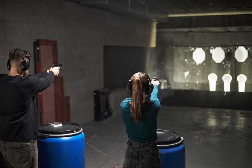 Shooter practicing with a rented handgun at an indoor shooting range in Sarasota