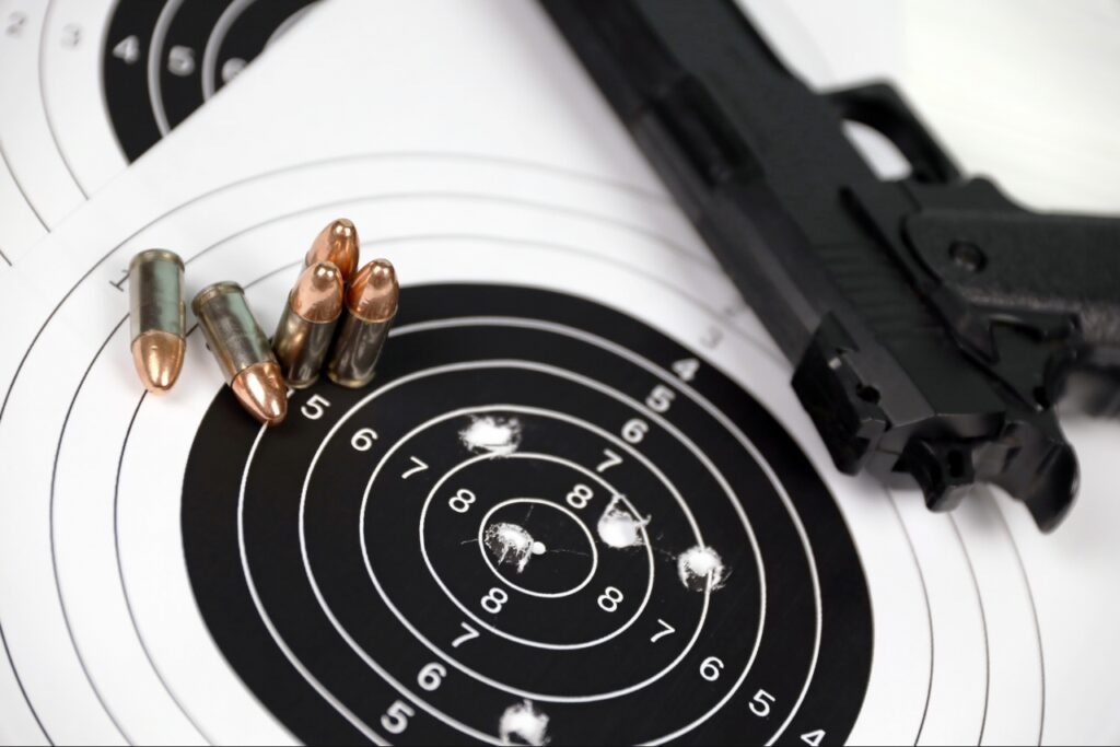 rent a gun in Sarasota | Shooter practicing safe handgun handling at an indoor shooting range