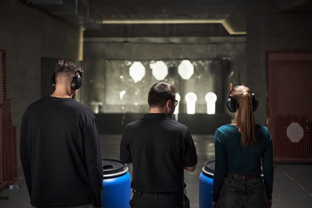 Shooter practicing gun range etiquette in Sarasota at an indoor shooting range