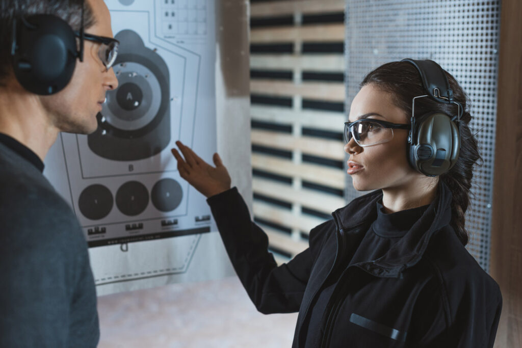 Shooters following gun range etiquette in Sarasota at a professional indoor shooting range