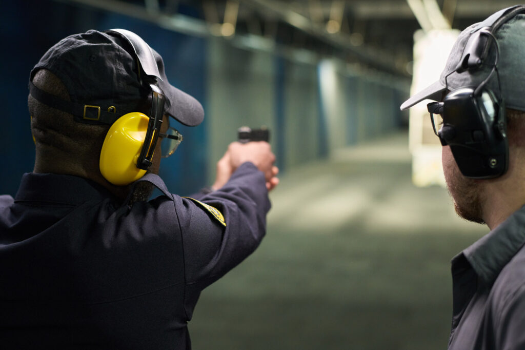 Shooter following proper gun range etiquette in Sarasota during an indoor range session