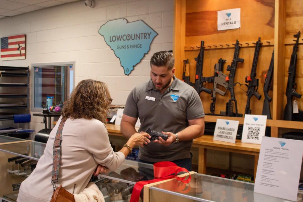 Handgun rentals Sarasota customer discussing available options with shooting range staff