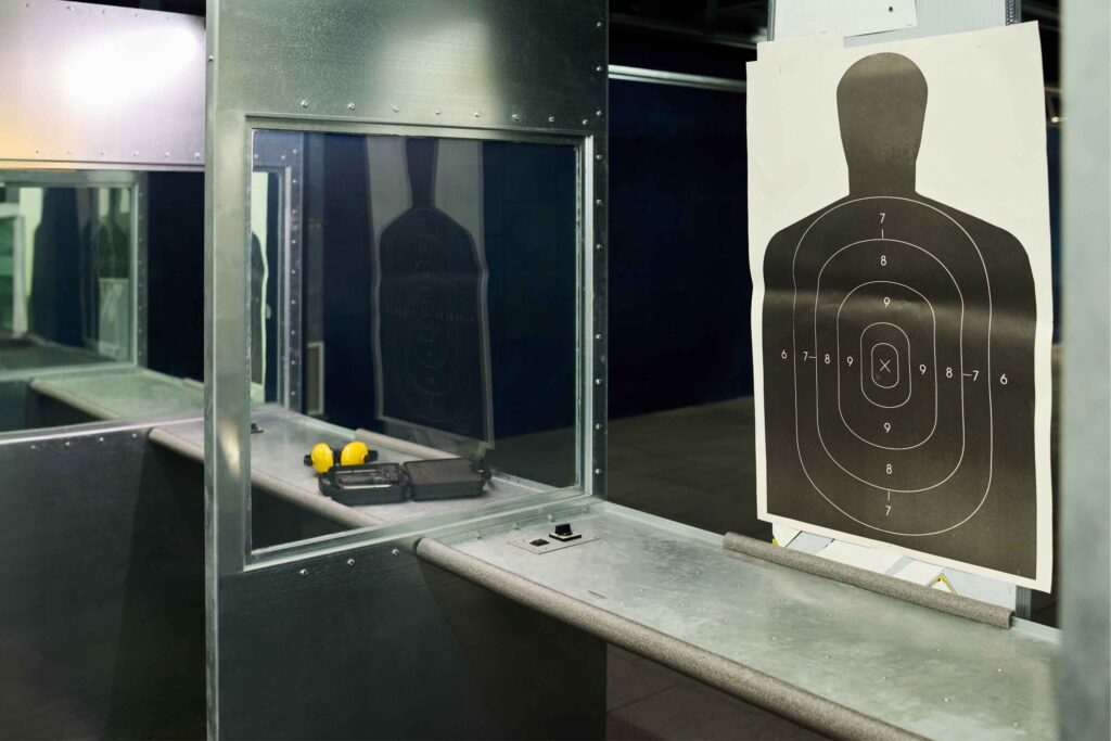 Indoor shooting range lanes illustrating the environment for organized recreational shooting