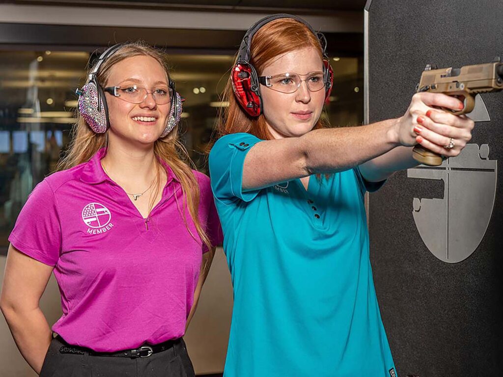 Women-only firearm training Sarasota participants learning about range safety with a female instructor